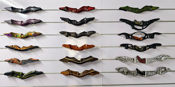 Bow risers and archery gear